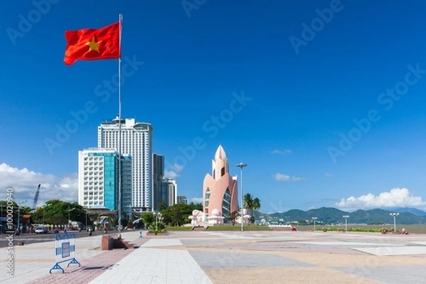 Obraz Nha Trang, Vietnam - December 09, 2015: Daytime view of Tram Huong (Lotus Flower) Tower and Nha Trang skyline in a sunny day on December 9, 2015, Nha Trang, Vietnam.