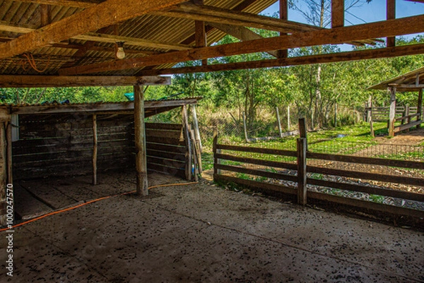 Fototapeta Fences and rustic buildings in the countryside