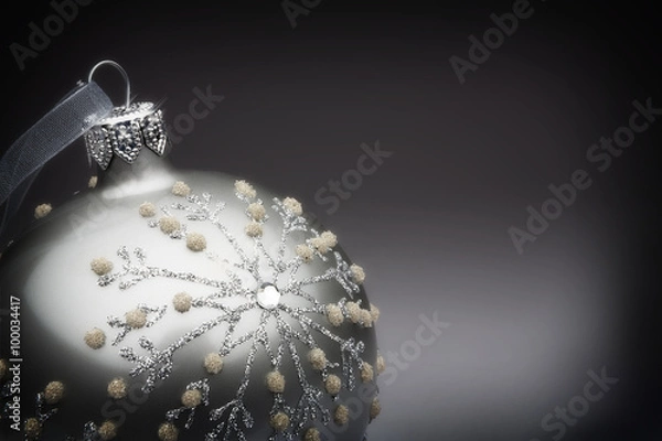 Fototapeta Silver tree decoration on a grey to black background