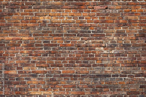 Obraz Red brick wall background with visible textures and patterns, perfect for creative projects or adding a nostalgic and timeless touch to any space.