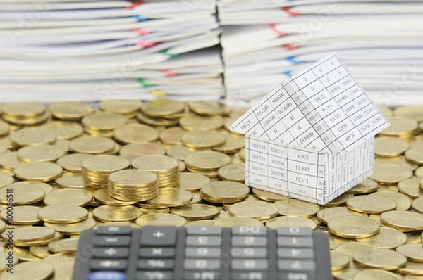 Fototapeta Pile of gold coins with house on stack gold coins