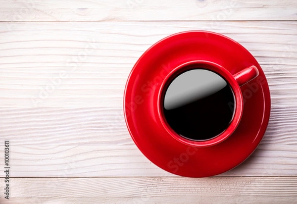 Obraz Red coffee cup on light wooden table