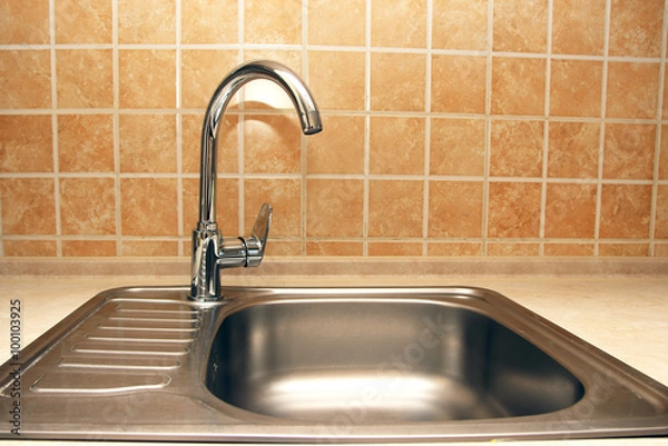 Obraz New faucets and sinks in the kitchen..