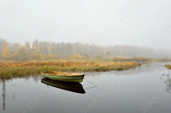 Obraz river and a boat scene during Fall season