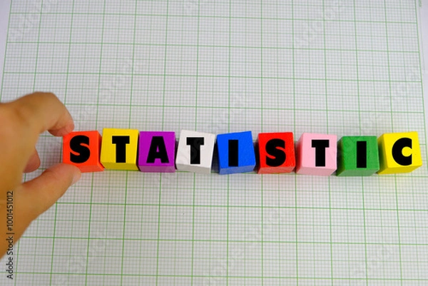 Fototapeta statistic words from colorful wooden blocks with letters, learning and education concept, bright background