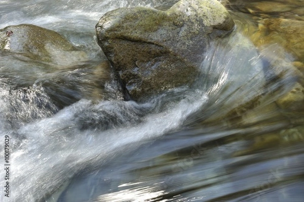 Obraz Water flowing over rocks