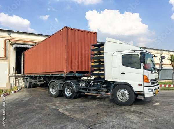 Fototapeta Container truck loading goods at warehouse