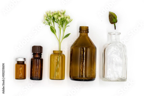 Obraz isolated on white background, colored glass bottles with essential oil and medicinal extracts, healthy lifestyle, body and health care, top view