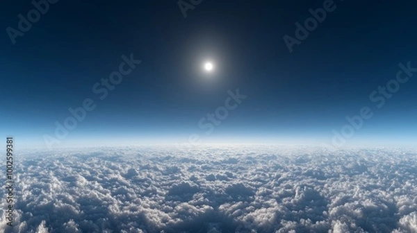Fototapeta A panoramic sky above sparse clouds, deep blue with a tiny bright sun