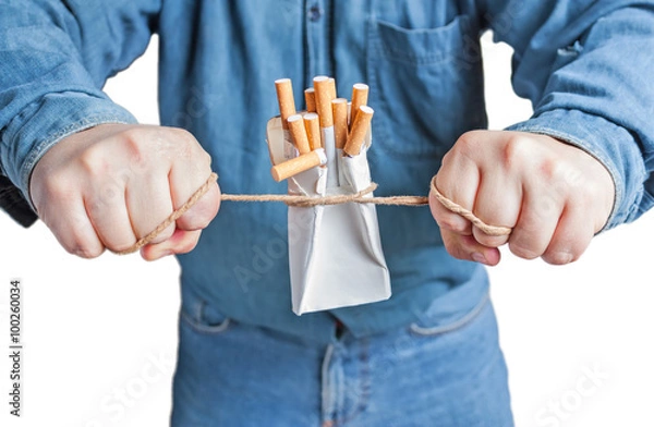 Obraz Human hands breaking the pack of cigarettes