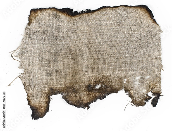 Obraz old burnt burlap on a white surface