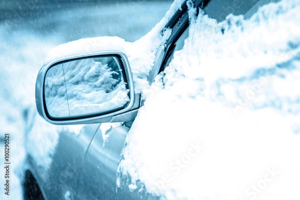 Fototapeta Car covered with snow in the winter