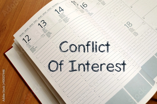 Fototapeta Conflict of interest write on notebook