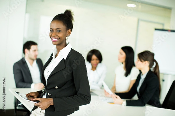 Fototapeta Young people working in the office