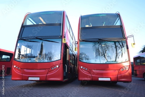 Obraz Red double decker buses parked at station