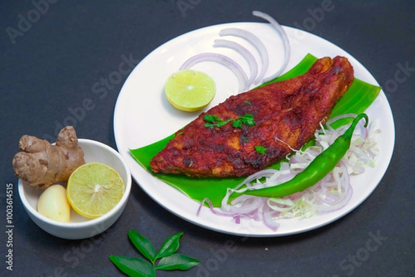 Fototapeta Fishy fry, Seer fish fry, salmon fish fry along with onion or onion slice, lemon, ginger, garlic, chili, cabbage, and spices on white bowl and white plate