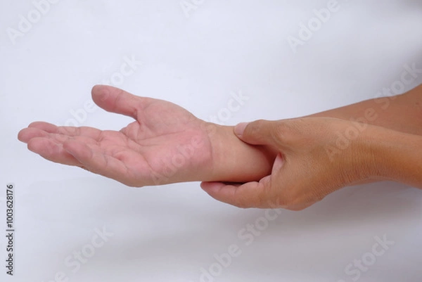 Fototapeta A pair of hands checking the pulse of the blood pressure