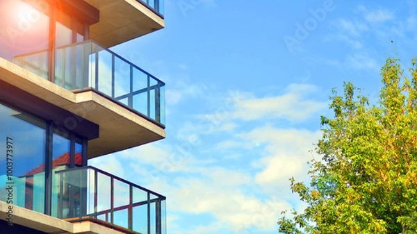 Fototapeta Eco apartment building saving energy and fresh air concept. European residential architecture harmonizing with nature. Eco-friendly living in city with greens. 