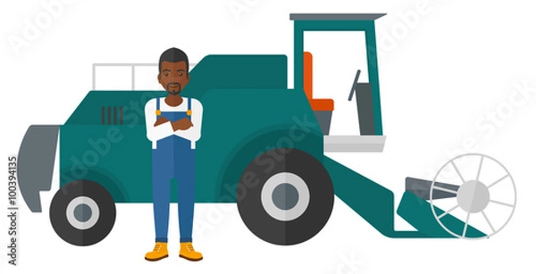 Fototapeta Man standing with combine on background.