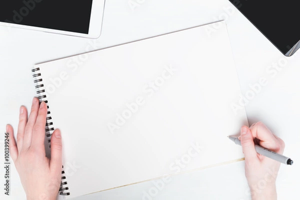 Obraz Woman hand with pen on a white background. Mockup