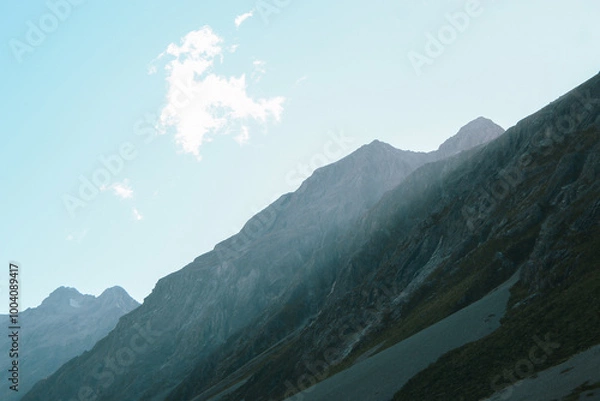 Fototapeta Mountain Range with Sunlight Streaking Through