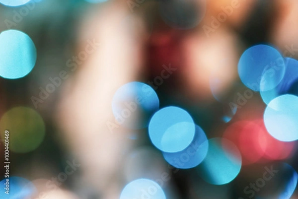 Fototapeta Blue and gold Christmas garland  bokeh lights on a tree, abstract multi colored blurred background.