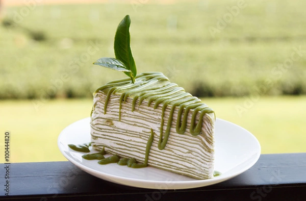 Obraz Green tea crepe cake on white disk