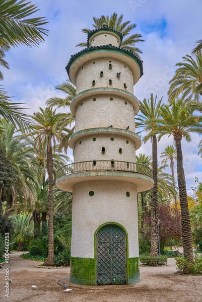 Obraz The dovecote tower in the Municipal Park of Elche. In the palm grove in elche, Valencian Community , Alicante, Spain