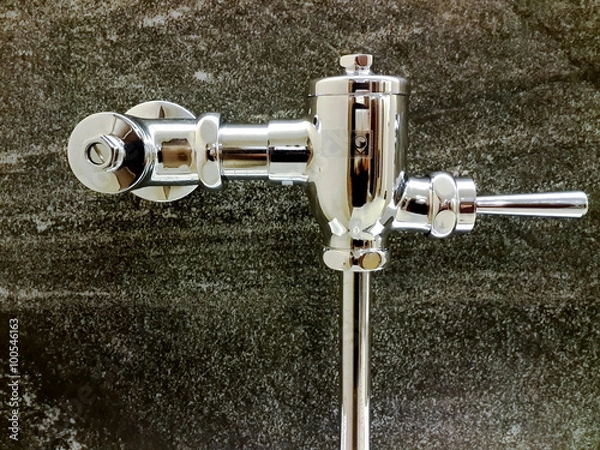 Obraz Flush valve on polished granite wall