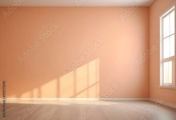 Fototapeta Empty room with peach-colored walls and a wooden floor.