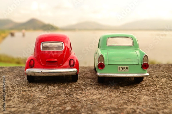 Obraz Red and green toy car park couple on the road