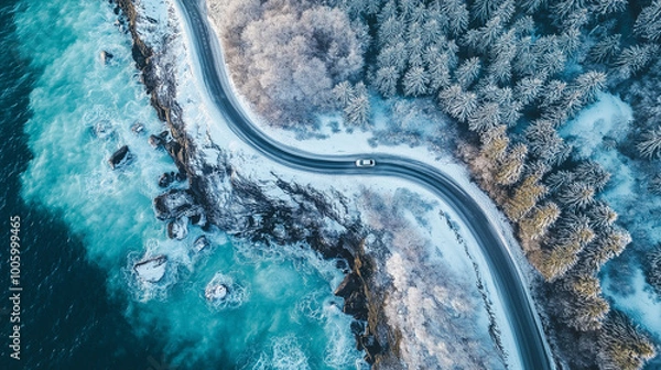 Fototapeta Top view of a car driving on a snow mountain road near the sea, winter forest landscape with ice and frost, nature scenery in a snowy countryside. Vacation concept, travel by car. Generative AI.