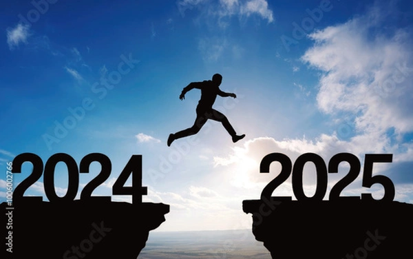 Fototapeta Happy new year 2025, Silhouette Man jumping from 2024 cliff to 2025 cliff on sky background. Сoncept of moving from year to year. New Year's concept.