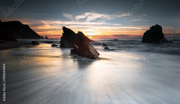 Obraz The drag of the wave to the sunset.