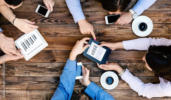 Fototapeta From above View of Business Team with Gadgets interacting