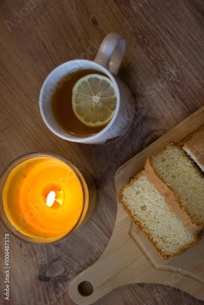 Obraz cake with lemon tea. Autumn evening.