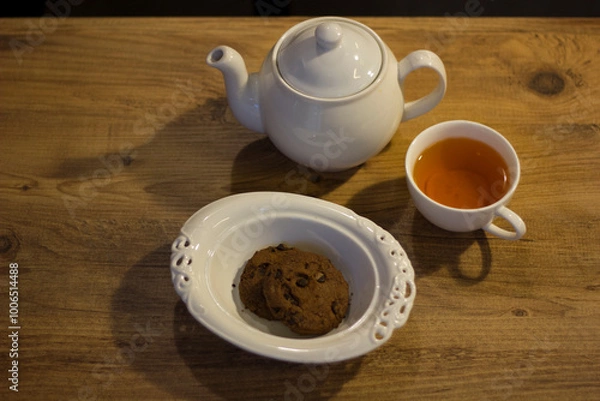 Obraz Autumn evening with tea, cookie and notebook.