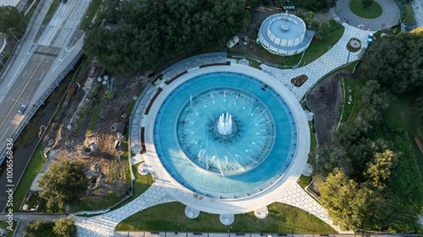 Obraz Aerial view of Friendship Fountain in Jacksonville, Florida, highlighting its circular design, water jets, and surrounding park area in Duval County.