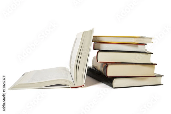 Fototapeta High books stack with open book isolated on white background. Many colorful book covers.
