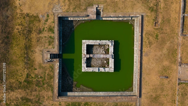 Fototapeta Capture history from above with this striking aerial image of an ancient moat-surrounded fortress