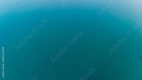 Fototapeta A tranquil gradient of blue hues embodies the serene essence of the ocean's depths in this soothing background
