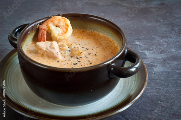 Obraz Icelandic fish soup with salmon and prawns. Served on a stone slate table.