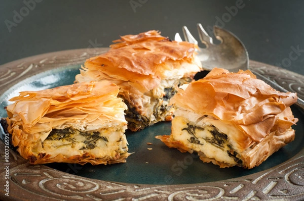 Obraz Home made spinach and feta pie. A popular Greek Cypriot dish made with layered filo pastry.