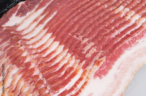Fototapeta Close-up shot of raw bacon slices