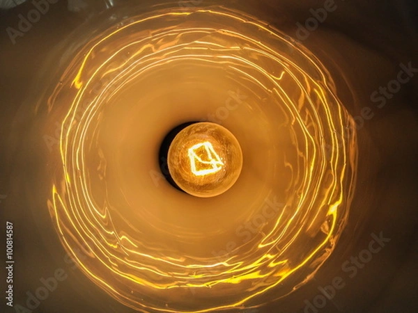 Fototapeta Light bulb illuminated and taken from above