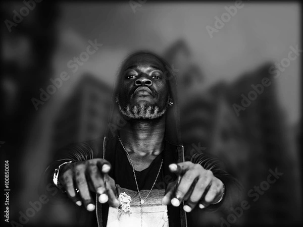 Fototapeta Double exposure of transgressive man and city blurred background