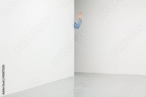 Obraz White walls corner with male hand waving