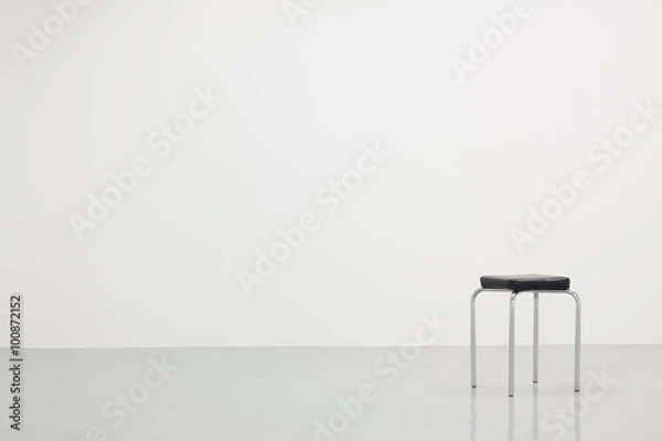 Obraz White wall texture with a chair