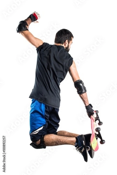 Fototapeta Man with skateboard jumping