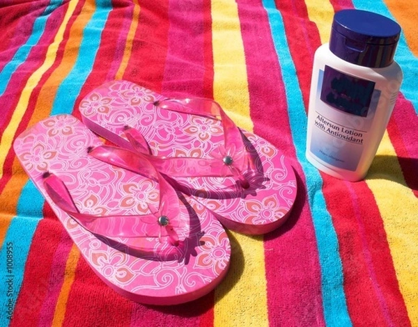 Fototapeta flip flops and sunscreen